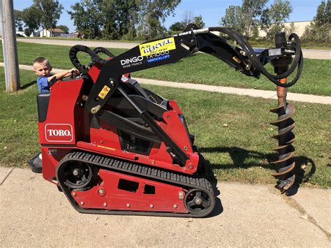 mini skid steer post hole digger|skid loader post hole auger.